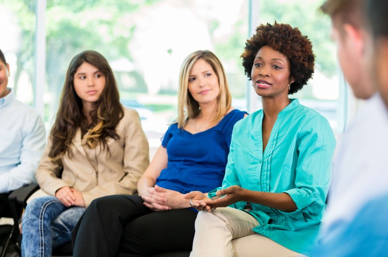 Image of people in a counseling session setting
